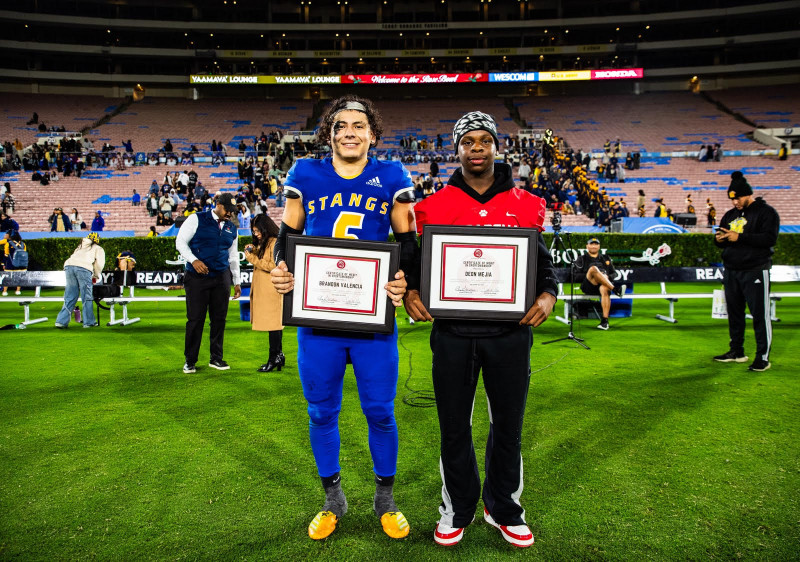 Photo of Brandon Valencia and Deon Mejia holding their certificates